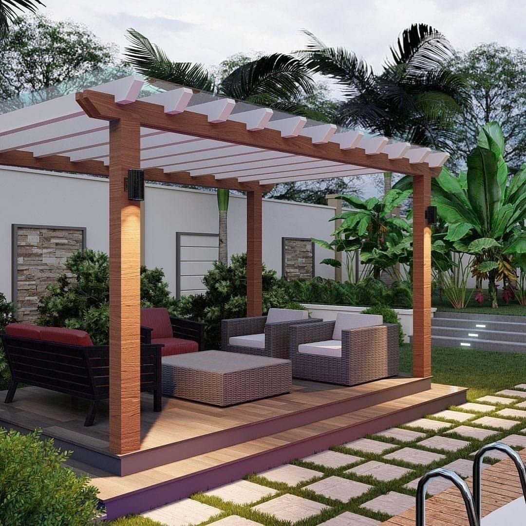 12 Deck Floor Design Ideas for Picture-Frame Borders to Patterned Layouts 3 A wooden pergola structure built over a raised wooden deck platform in a lush garden.