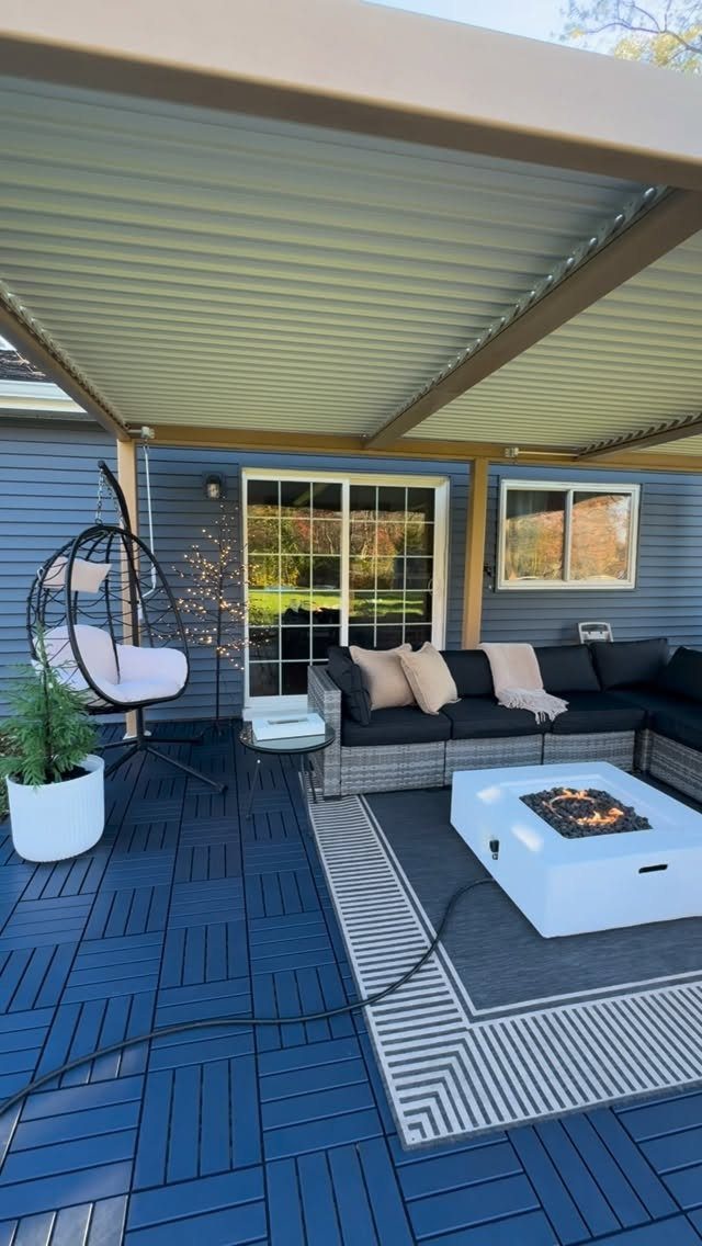 12 Deck Floor Design Ideas for Picture-Frame Borders to Patterned Layouts 11 Blue geometric composite deck flooring in a modern outdoor living space with furniture.